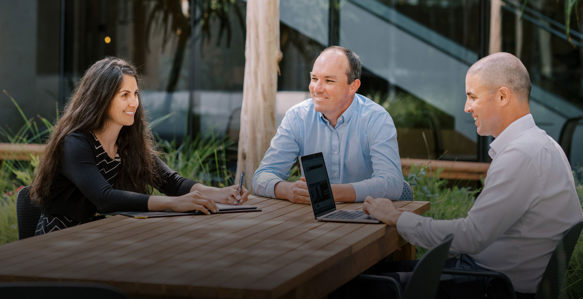 Goldstein Browne, PC Lawyers sitting at a table planning